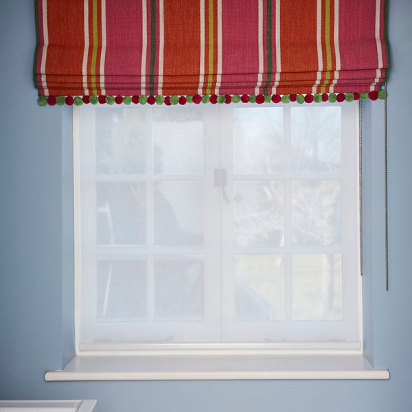 Bespoke blind in Belinda by Manuel Canovas, pompoms by The Stripe Company